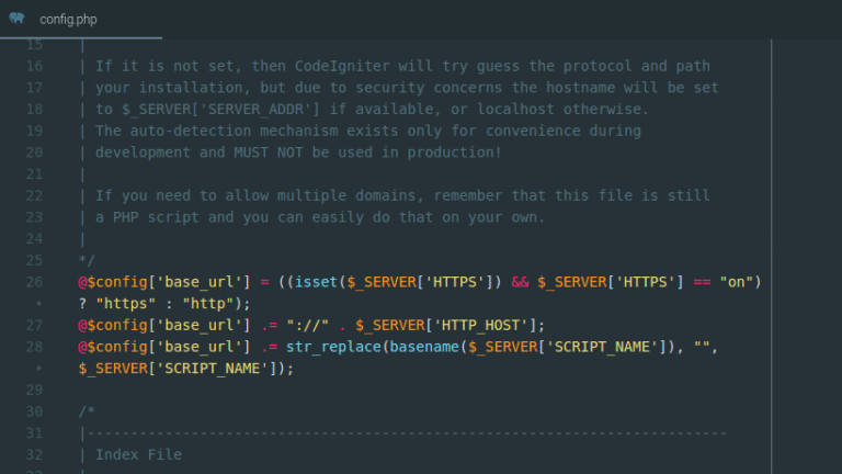 Tampilan editor kode menunjukkan logika PHP untuk mengatur variabel config base_url menggunakan global server variables.